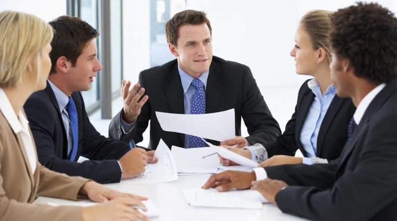 Group Of Business People Having Meeting In Office